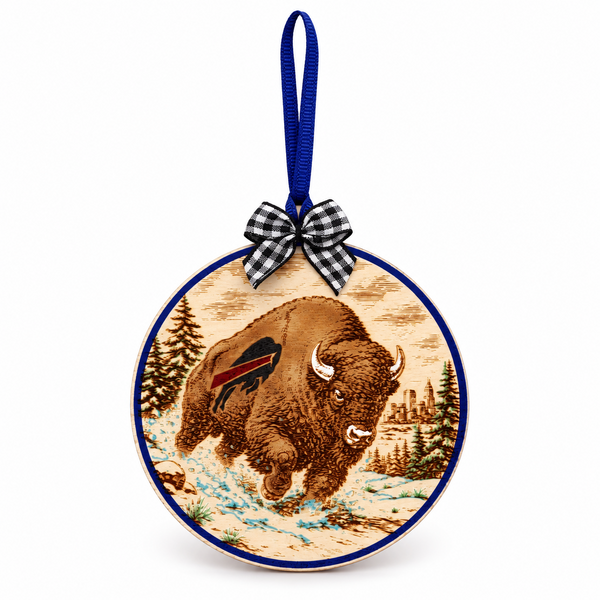 Charging Buffalo birch Christmas ornament with blue ribbon and plaid bow on white background