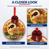 Close-up of a Buffalo football ornament with plaid bow and front artwork